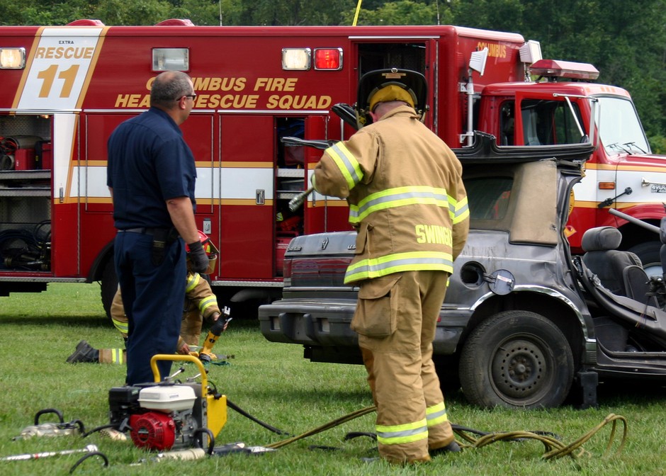 ambulance fireman burnt car
