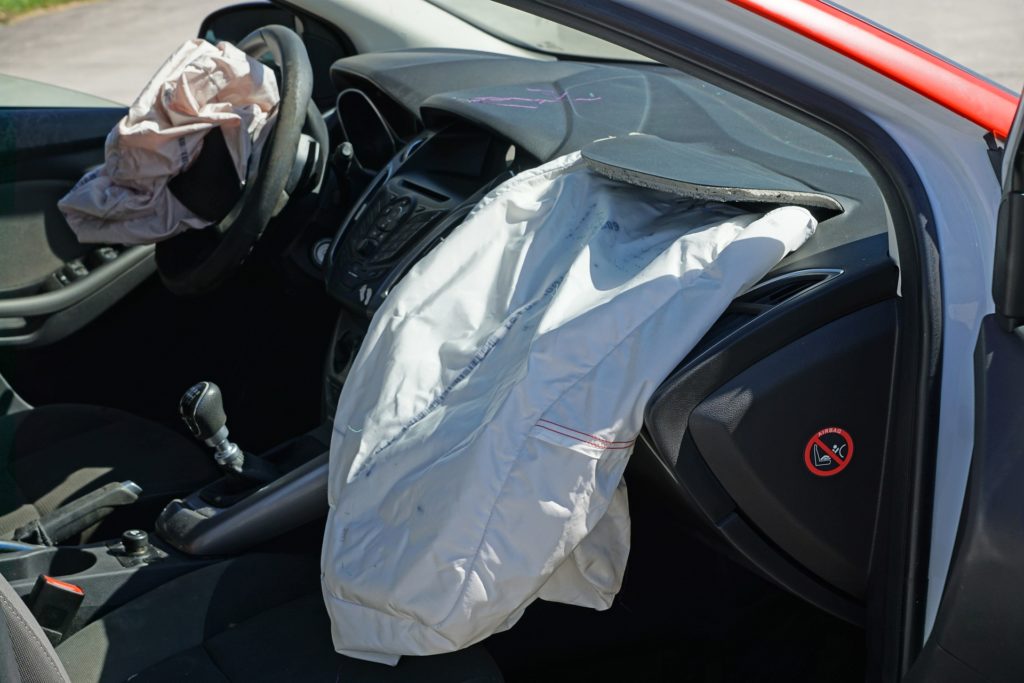 A vehicle that has been in a car accident where the airbags have been deployed.