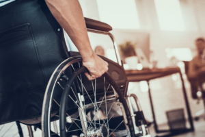 Man in a wheelchair. Some personal injuries can cause permanent disabilities.