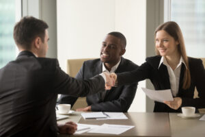 a lawyer shaking hands with clients